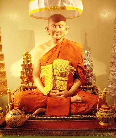 A statue of a monk
Description automatically generated